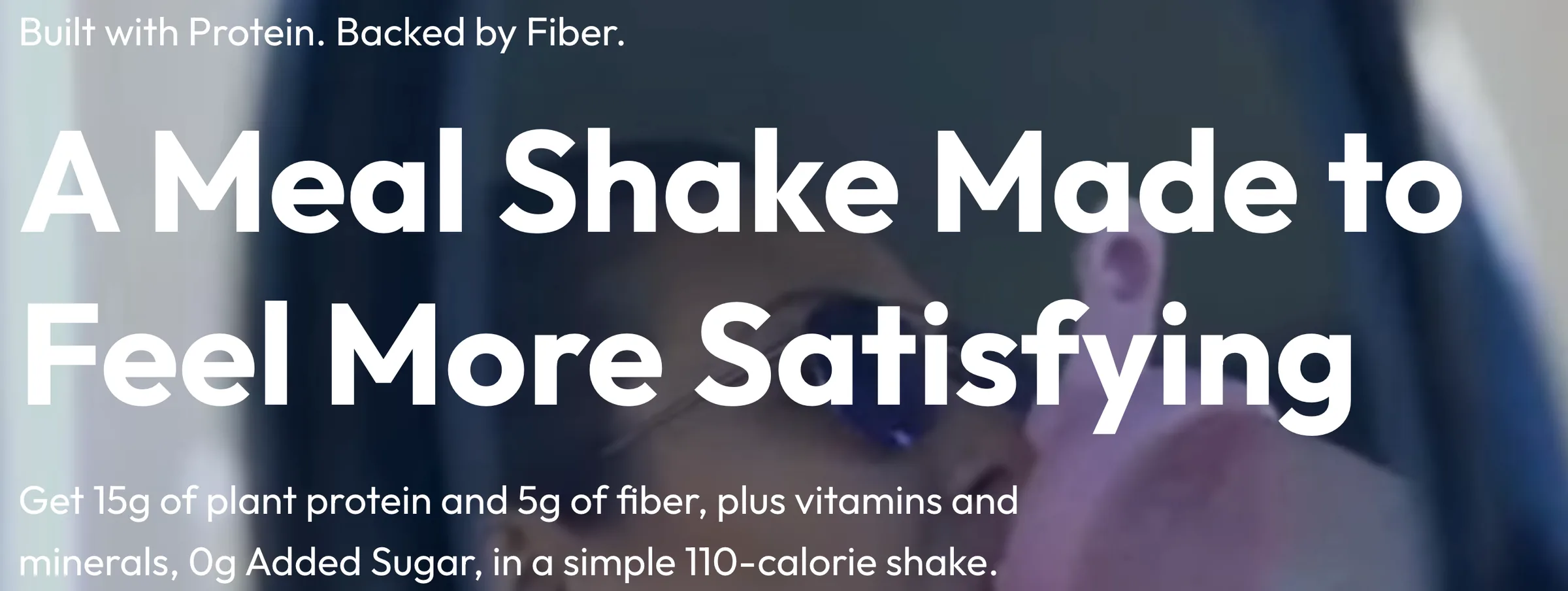 Close-up of the homepage headline 'A meal shake made to feel more satisfying' in bold white type
