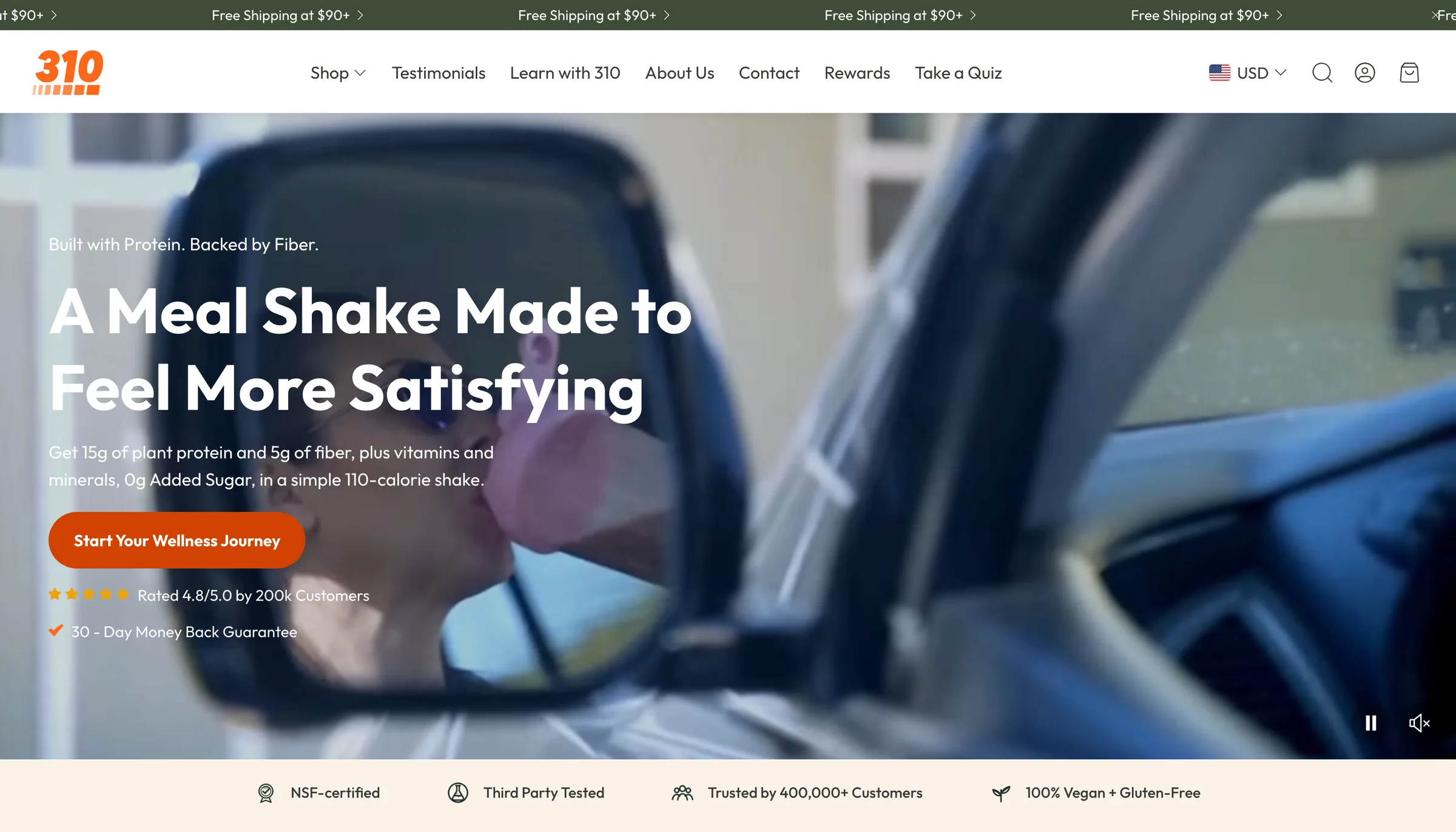 310 Nutrition homepage on desktop, under the headline 'A meal shake made to feel more satisfying', with an orange call to action and a trust bar below
