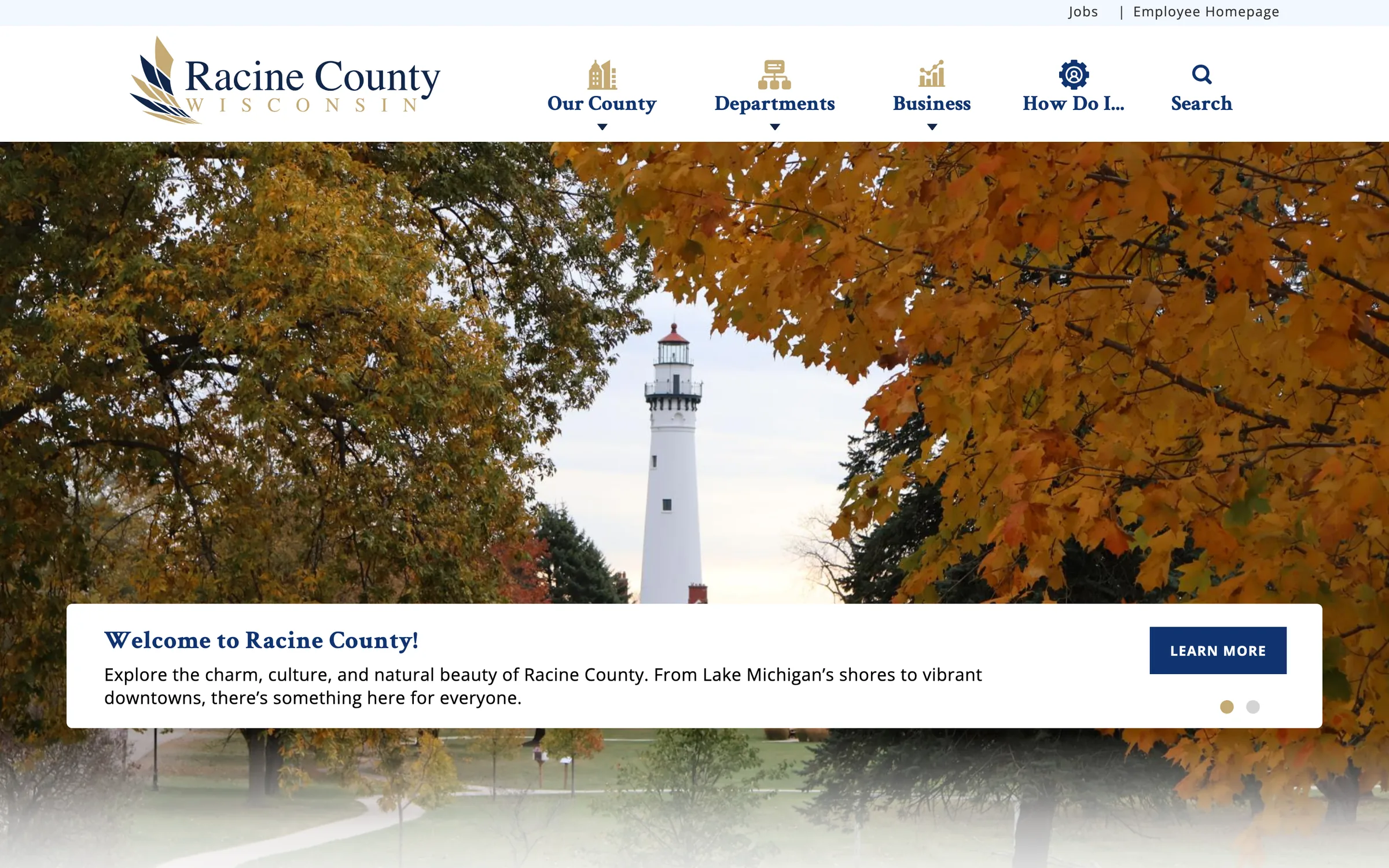 Racine County homepage on desktop: a lighthouse framed by autumn trees, with a 'Welcome to Racine County' panel and navigation for Our County, Departments, Business and How Do I